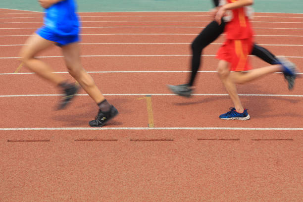 istock Long distance runners are running on the track 1878346847