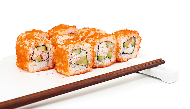 istock Sushi with chopsticks isolated over white background 187841002