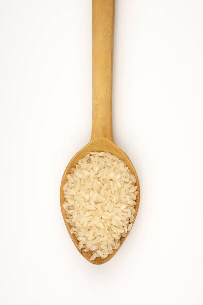 istock Rice with wooden spoon 187841067
