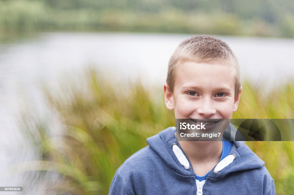 Adorable boy smiling Adorable boy with retainer on teeth smiling outdoors 8-9 Years Stock Photo