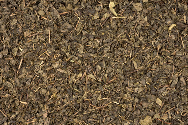 textura de chá verde - jasmine tea leaf dry green tea - fotografias e filmes do acervo
