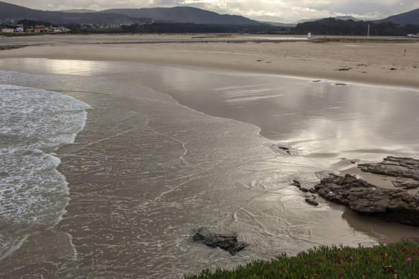 istock low tide in A Rapadoira beach in Foz 1878427000