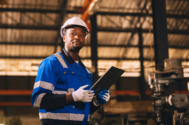 istock Production engineers are assisting adjusting and maintaining factory machine, Male workers technician examining control the industrial technology tool, professional repair men work in industry plant 1878434132