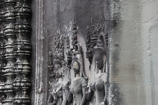 Carvings of mythological women (Apsara) in Angkor Wat temple