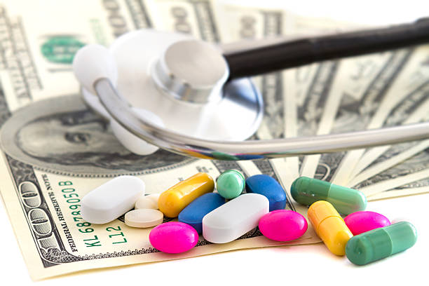 istock Pills and money 187843766