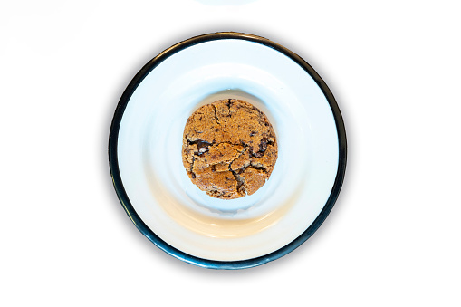 Chocolate chip cookie on plate. Top view.
