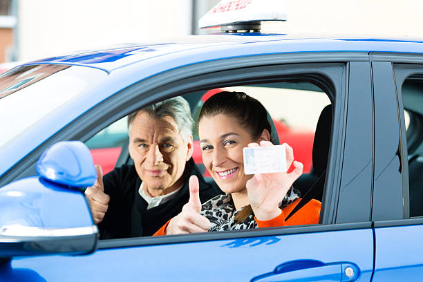 istock Young woman at driving lesson 187845198