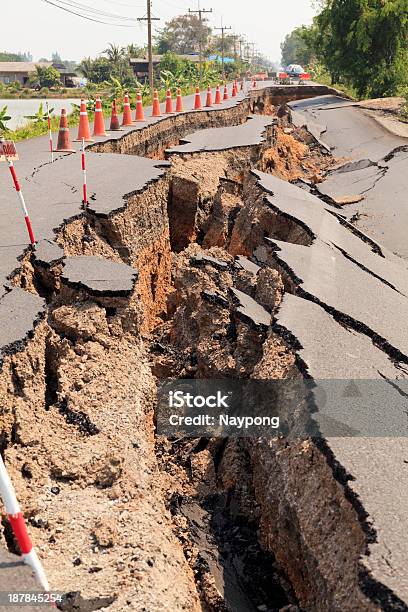 Cracked Asphalt Road Revealing Dirt Stock Photo - Download Image Now - Earthquake, Asphalt, Black Color