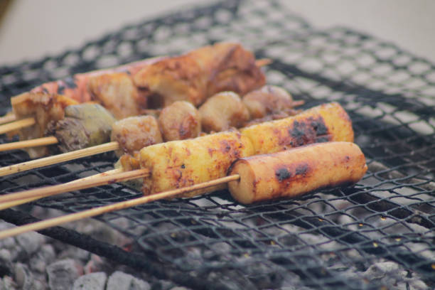 istock grilling bbq skewers at a food stall 1878467018
