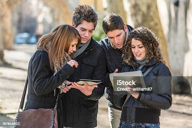 Group Of Friends With Digital Tablet Stock Photo - Download Image Now - Adolescence, Adult, Beautiful People