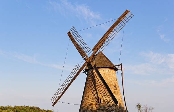 istock Old wooden mill against the blue sky 187847071