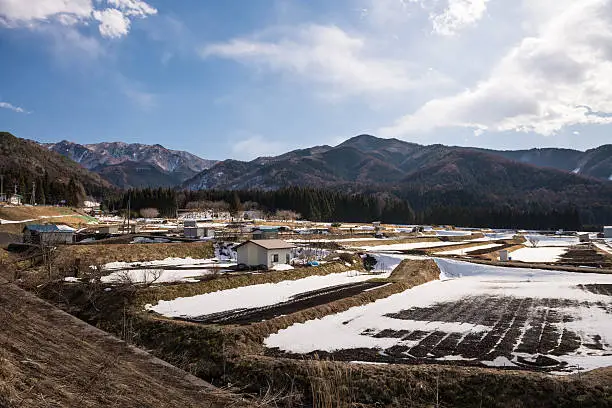 Agriculture area during winter with mountain background in Yudanaka, Nagano.
