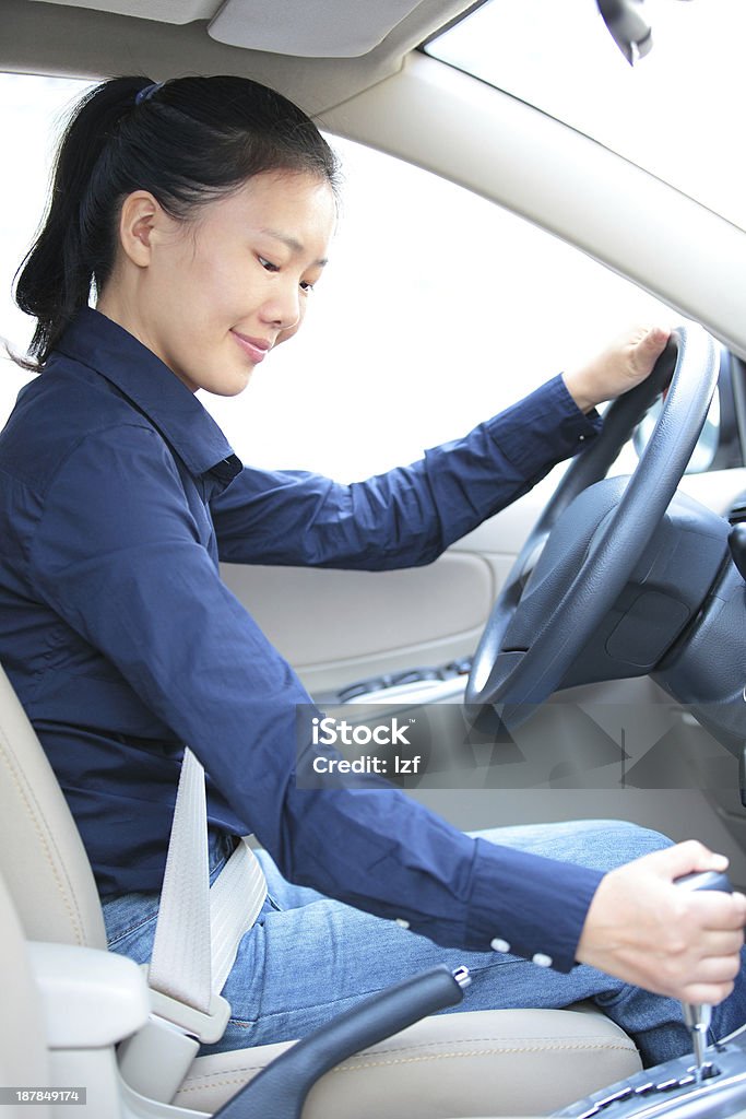 asian businesswoman driving a car beautiful asian businesswoman driving a car Adult Stock Photo