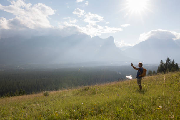 istock Hiker taking smart phone picture 187849825