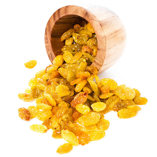 Yellow Shiny Raisins isolated on white background