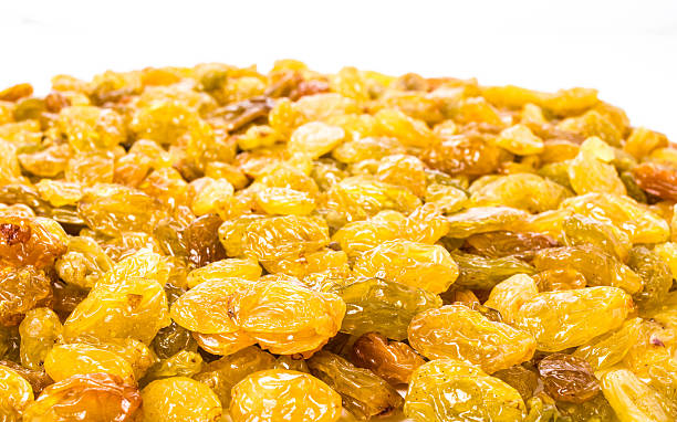 Yellow Raisins may use as textured background, close up.