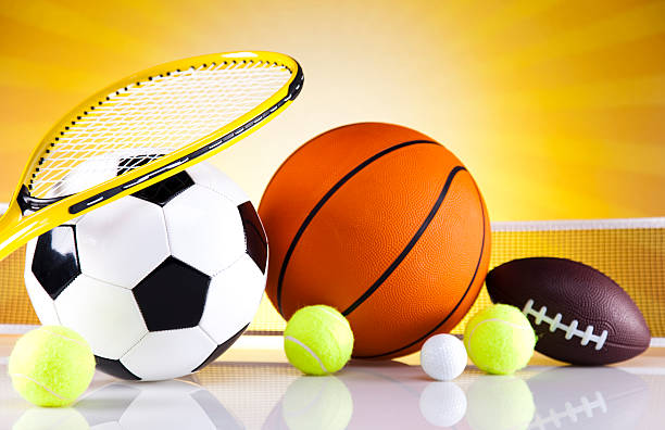 istock Assorted sports equipment and sunset 187854207