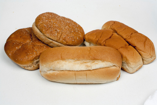 Sandwich, hamburger and hot dog buns on white background.