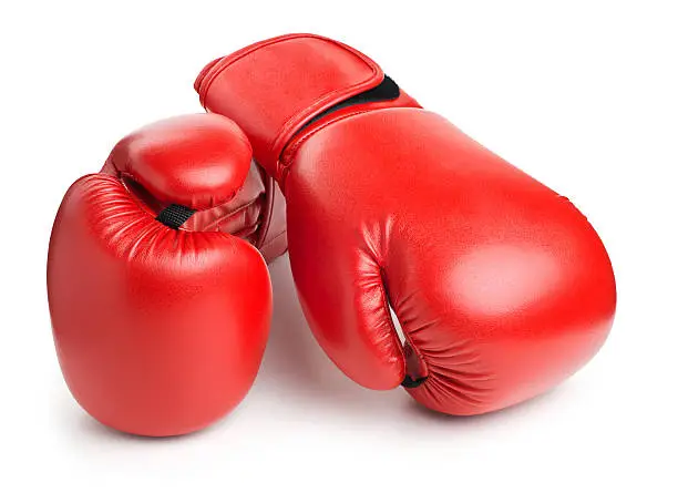 Photo of red leather boxing gloves isolated on white