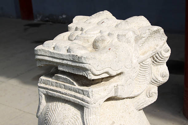 istock lion stone in a temple 187860098