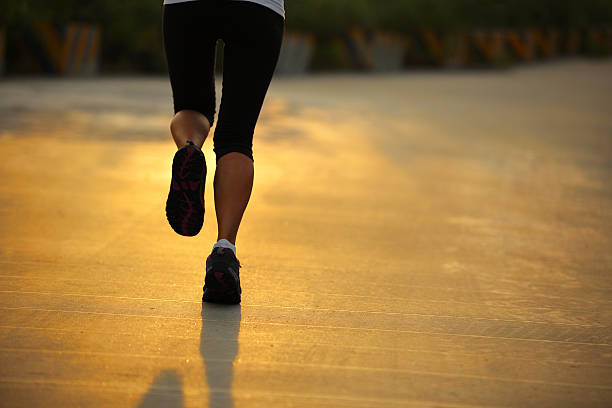 istock running under morning sunshine 187860511