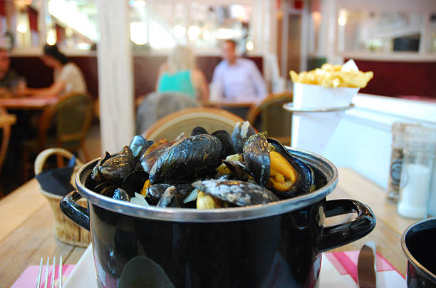 Moules Frites in Belgium Delicious Moules Frites in Ghent, Belgium moules frites stock pictures, royalty-free photos & images