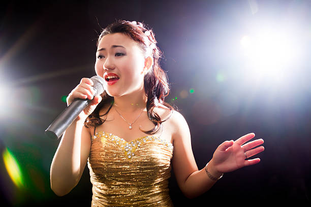 Singing woman of Asia Concert young Asian singer of the girl diva human role stock pictures, royalty-free photos & images