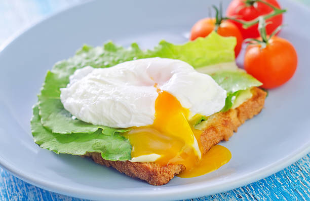 egg-poached sandwich with egg granary toast stock pictures, royalty-free photos & images