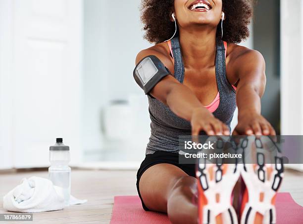 Getting Ready To Do My Workout Stock Photo - Download Image Now - Home Workout, Stretching, African Ethnicity