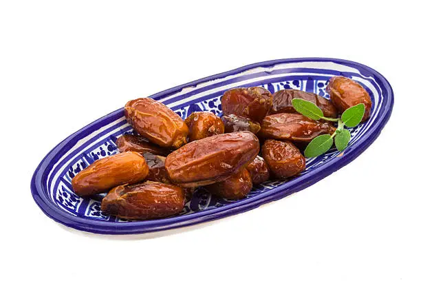 Dates with leaf on the plate