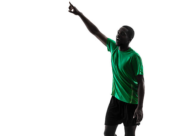 istock african man soccer player pointing silhouette 187868785