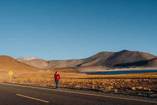Woman enjoying life on the road in Atacama