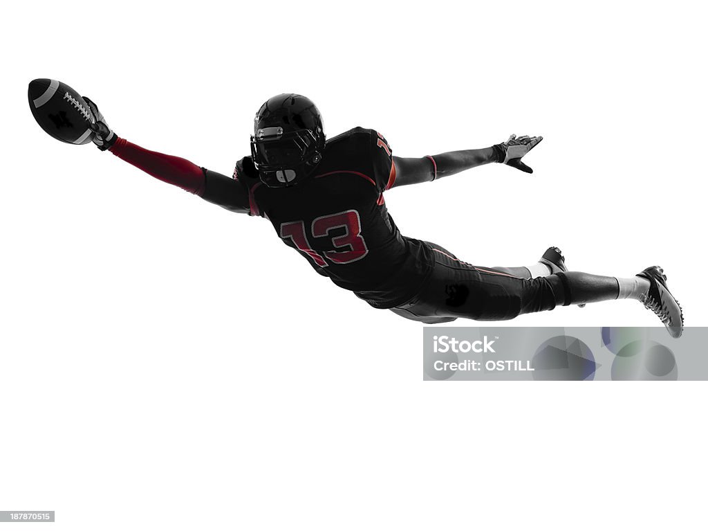 Silhouette of American football player scoring touchdown one american football player scoring touchdown in silhouette shadow on white background Touchdown Stock Photo