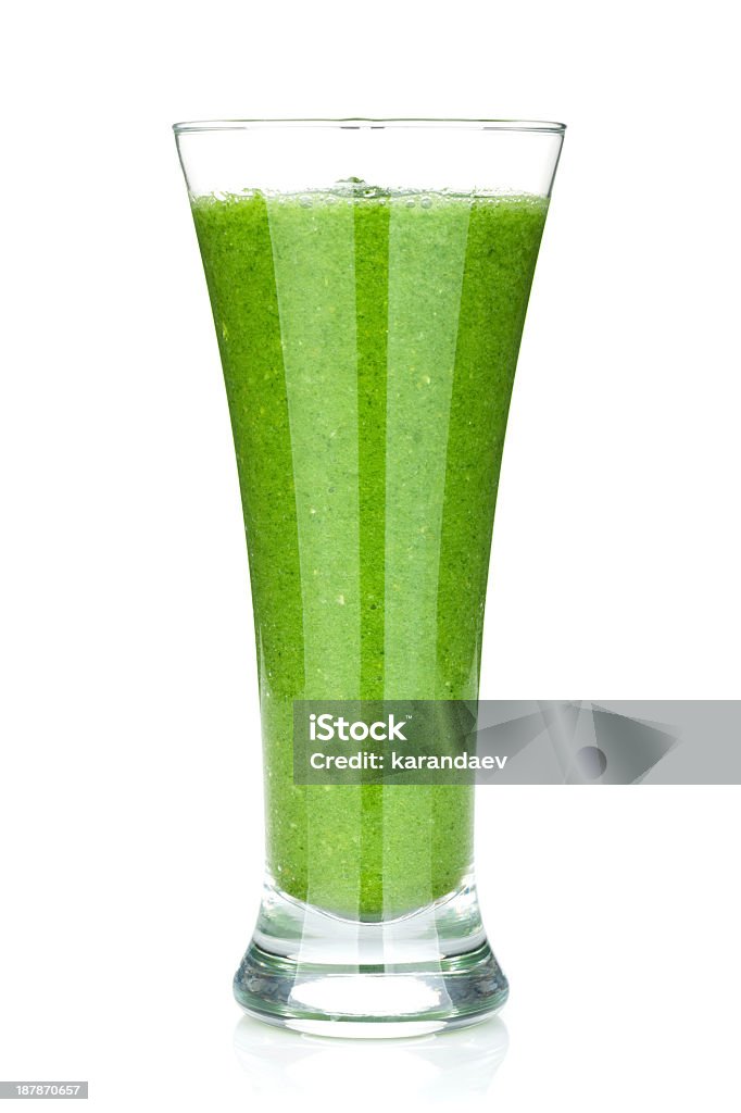 Green vegetable smoothie in a tall glass Green vegetable smoothie. Isolated on white background Smoothie Stock Photo