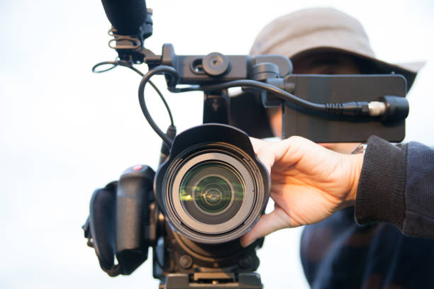 istock man filming with a professional camcorder 1878722793