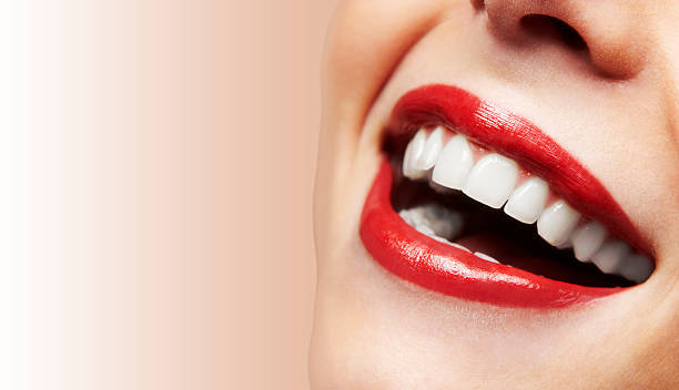 istock Woman smiling with great teeth on white background 187872300