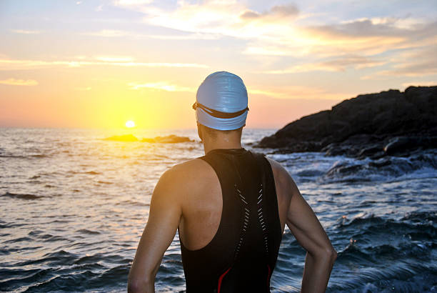 istock young athlete triathlon in front of a sunrise 187873307