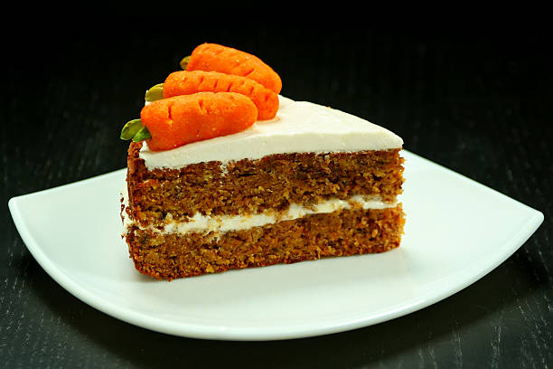 Sweet slice of carrot cake on white plate