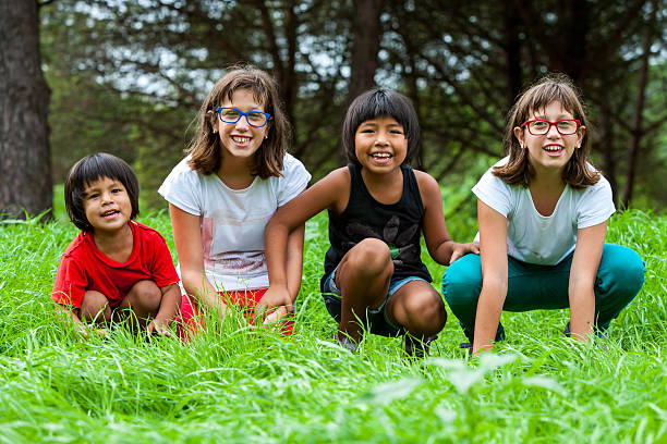 Portrait of handicapped girls with latin friends on farm.