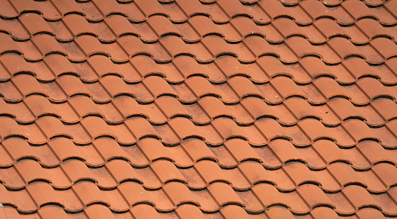 close up on red shingle on the roof