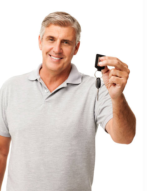 istock Smiling Man Showing New Car Key 187878749