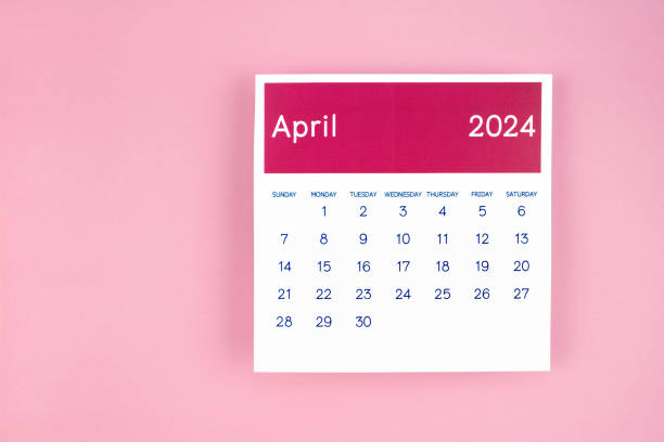 istock Calendar page April 2024 on pink background. 1878842316