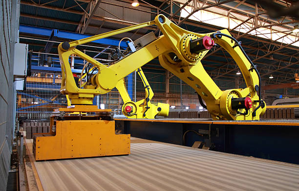 istock Automated manufacture production line robots picking up goods on conveyor 187884270