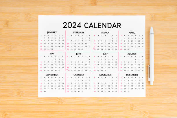 istock 12 months desk calendar 2024 and pen. 1878842826