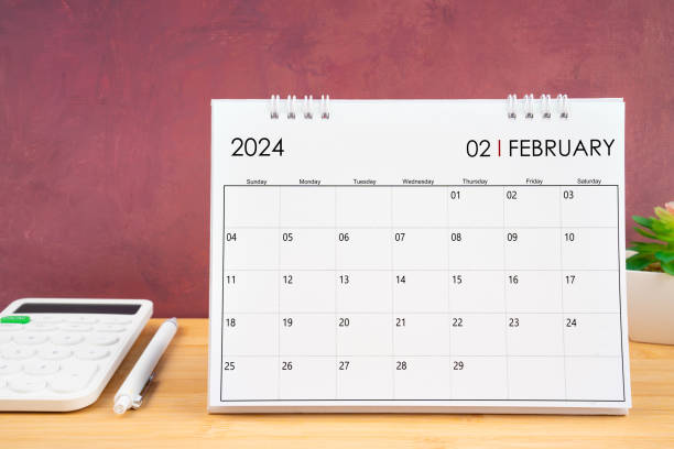 istock February 2024 white calendar and calculator with pen 1878842831