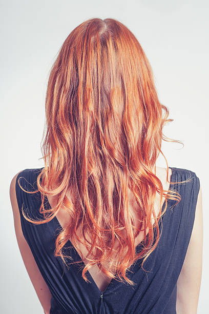 istock Gorgeous curly redhead girls back. Toned image 187886493