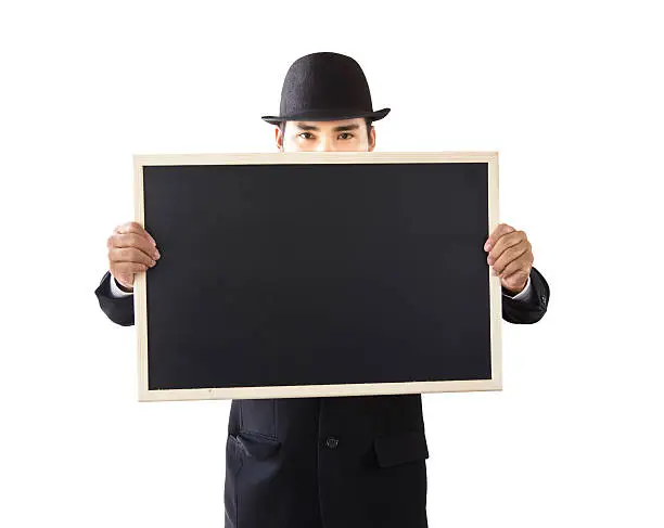 Businessman holding a blackboard in hands.