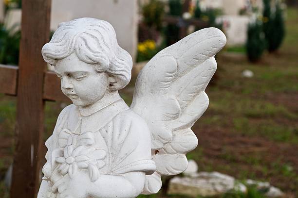 Angel in cemetery stock photo