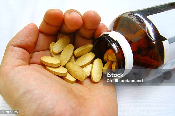 Hand And Pill Stock Photo - Download Image Now - Adult, Antibiotic, Bottle