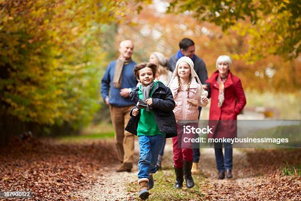 Multiple Generations Of A Family Walking In Fall Stock Photo - Download Image Now - Autumn, Family, Walking